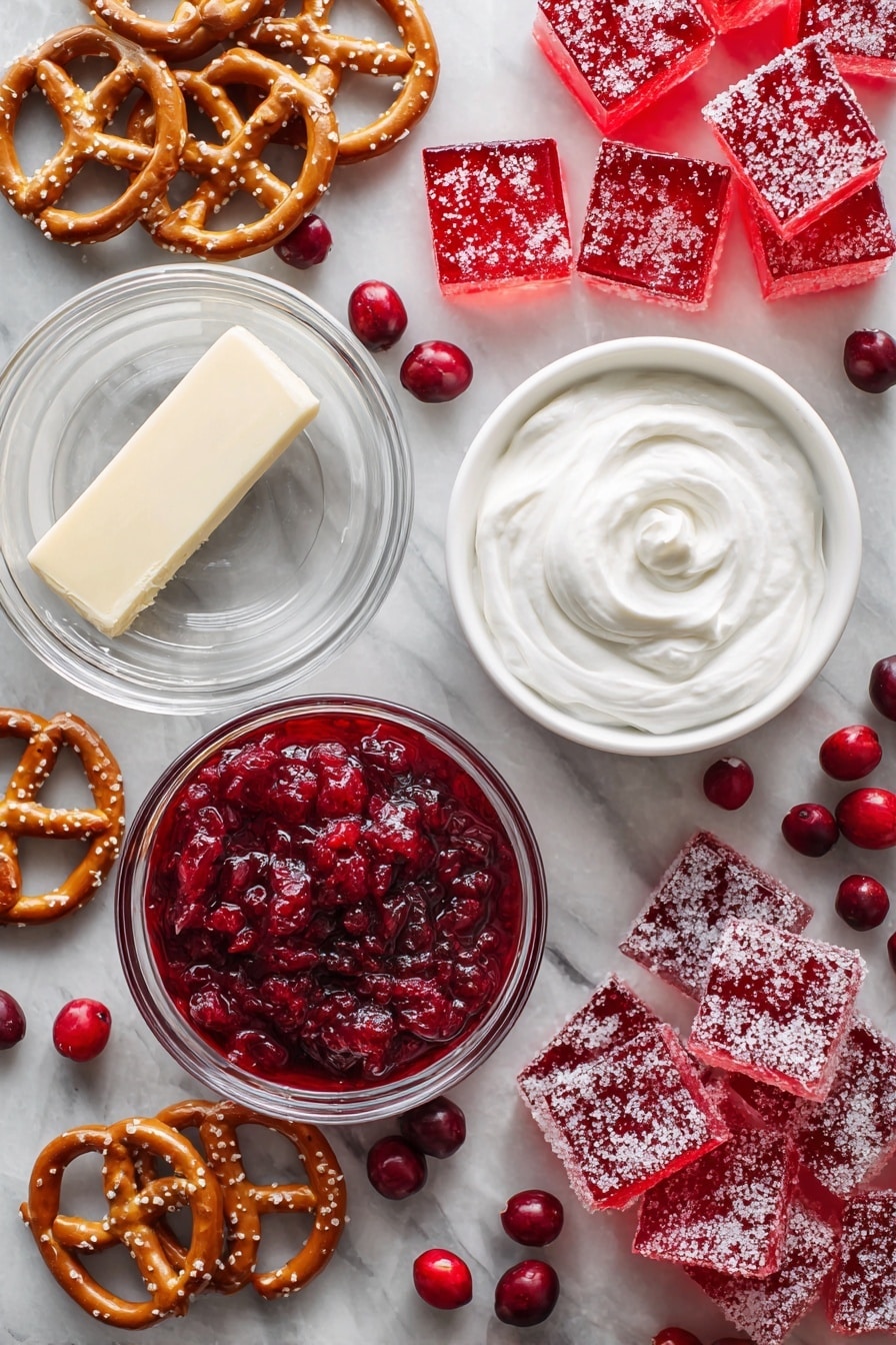 Flat lay of broken salted pretzels, a stick of unsalted butter partially melted, a bowl of creamy white cream cheese, a tub of fluffy white Cool Whip, bright red whole berry cranberry sauce with visible berries, two boxes of vibrant red cranberry Jello powder next to a cup of steaming boiling water, and scattered white granulated sugar crystals, all beautifully arranged on a white marble surface, photo taken with an iphone --ar 2:3 --v 7 - Cranberry Pretzel Salad, Cranberry Pretzel Salad how to make, holiday cranberry pretzel dessert, easy cranberry pretzel dessert, salty and sweet pretzel salad