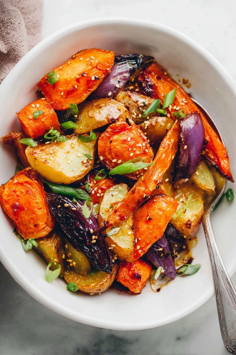 The image shows a white bowl filled with roasted vegetables including orange carrot chunks, golden brown potato pieces, purple onion segments, and small green onion slices sprinkled on top. The vegetables have a slightly charred and crisp texture with light seasoning and sesame seeds scattered over them. A silver spoon rests inside the bowl on the right side. The bowl is set on a white marbled surface, and a woman's hand is partially visible in the bottom left corner. photo taken with an iphone --ar 2:3 --v 7 - Miso Glazed Roasted Root Vegetables, roasted root vegetables with miso glaze, healthy miso vegetable side dish, flavorful root veggie recipes, vegan roasted root vegetables