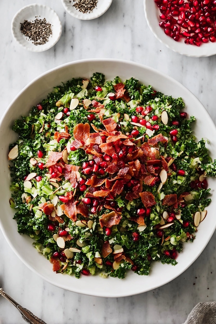 A large white bowl filled with a colorful salad is placed on a white marbled surface. The salad has a base layer of chopped kale and light green vegetables, topped with scattered almond slices that are thin and oval-shaped. Bright red pomegranate seeds are spread evenly across the salad, adding a pop of color. Crispy red bacon pieces are scattered on top, giving texture and contrast to the green and red colors. There are a few small white dishes around the bowl with black pepper and pomegranate seeds. The photo taken with an iphone --ar 2:3 --v 7 - Shredded Brussels Sprout Salad, Brussels Sprouts Salad, Healthy Brussels Sprouts Recipes, Easy Vegetable Salad, Fresh Side Salad Recipes