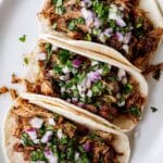 Slow Cooker Carnitas Tacos with Crispy Pork and Fresh Toppings Recipe