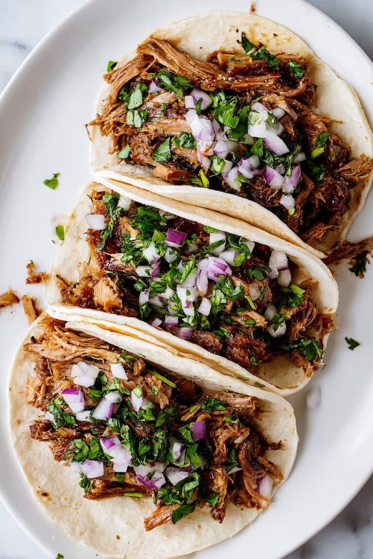 Slow Cooker Carnitas Tacos with Crispy Pork and Fresh Toppings Recipe